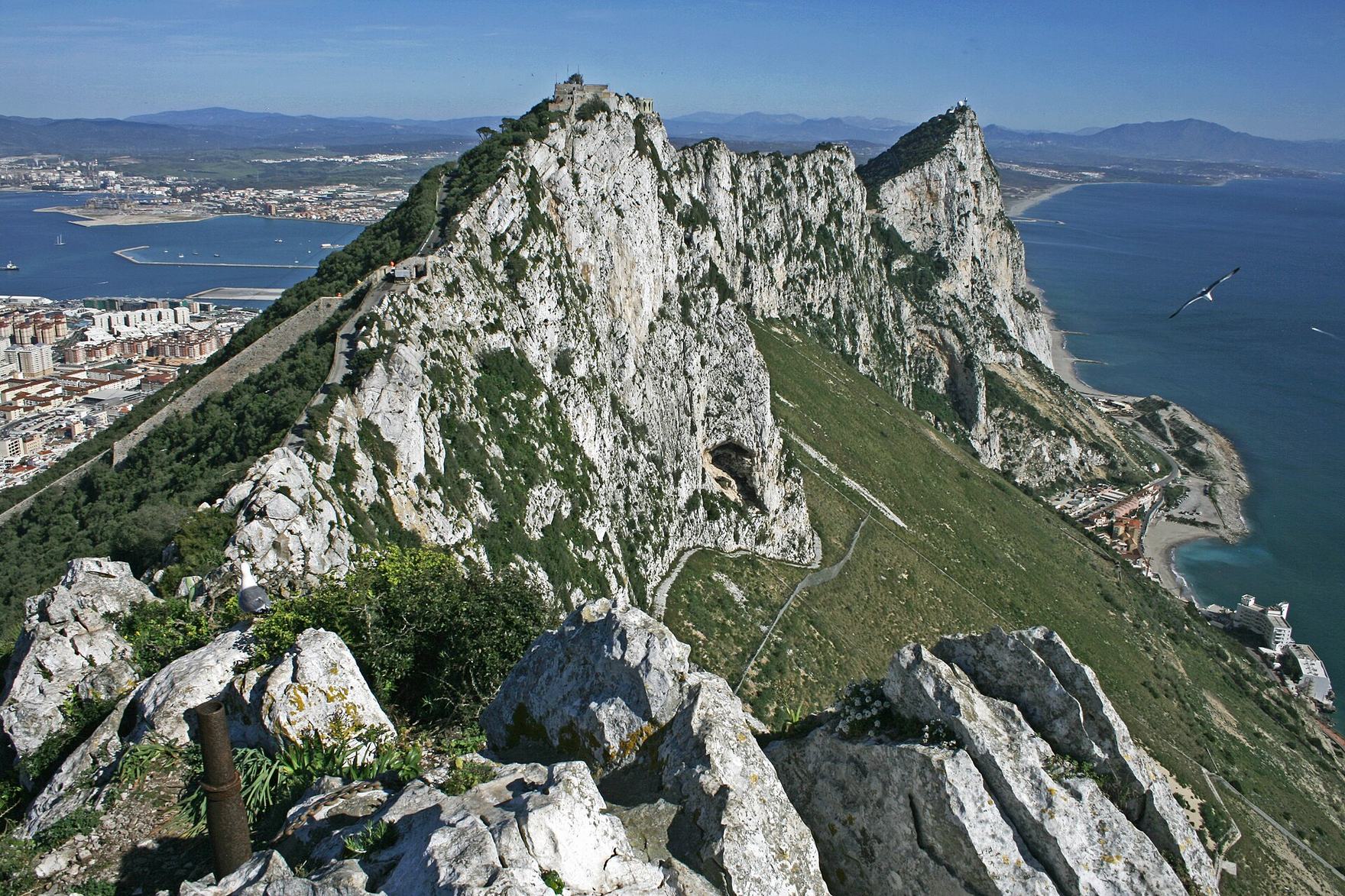 The limestone ridge of the Rock of Gibraltar seen from its southern summit, with the town and bay on the left and the Mediterranean on the right